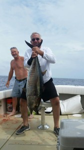 here is Mr Fred aboard the "Scrappy" with Capt Josh with a nice rainy day tuna from yesterday.